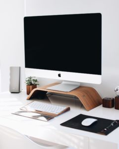 Desktop computer on white desk.